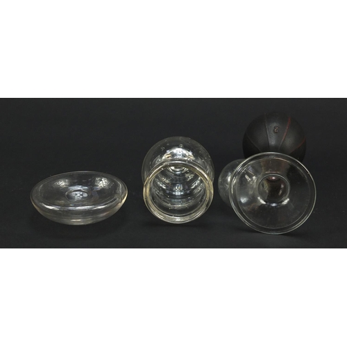 902 - Clear glass breast pump with balloon handle, cupping cup and nipple guard, the largest 14cm high