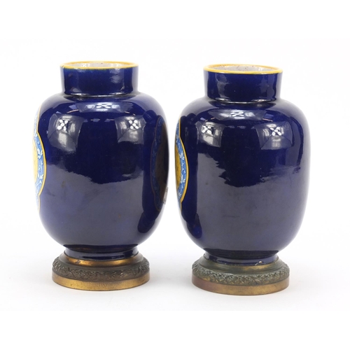 344 - Pair of French faience colbalt blue ground vases on gilt metal bases by Vierzon, each with classical... 