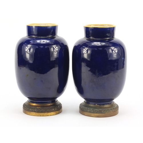 344 - Pair of French faience colbalt blue ground vases on gilt metal bases by Vierzon, each with classical... 