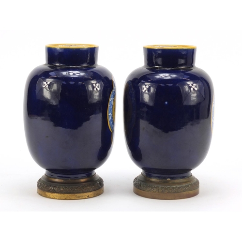 344 - Pair of French faience colbalt blue ground vases on gilt metal bases by Vierzon, each with classical... 