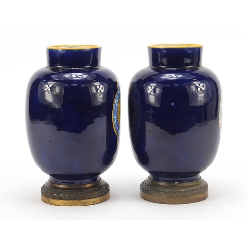 344 - Pair of French faience colbalt blue ground vases on gilt metal bases by Vierzon, each with classical... 