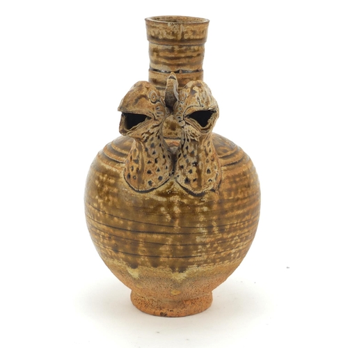 610 - Continental glazed pottery jug with twin bird head spout, possibly South American, 16cm high