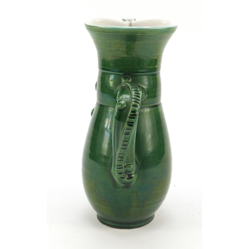 1982 - Green glazed jug modelled as a soldier, 24cm high