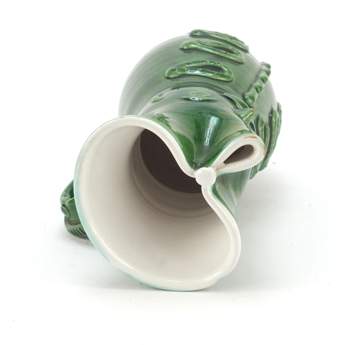 1982 - Green glazed jug modelled as a soldier, 24cm high