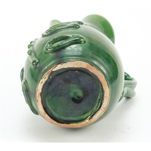 1982 - Green glazed jug modelled as a soldier, 24cm high