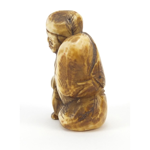 221 - Japanese carved ivory Netsuke of seated gentleman, 4cm high