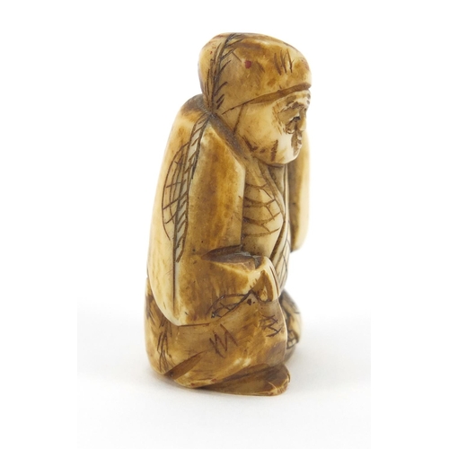 221 - Japanese carved ivory Netsuke of seated gentleman, 4cm high