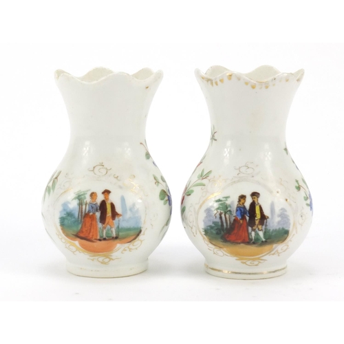 348 - Pair of Continental porcelain vases hand painted with panels of courting couples and flowers, painte... 