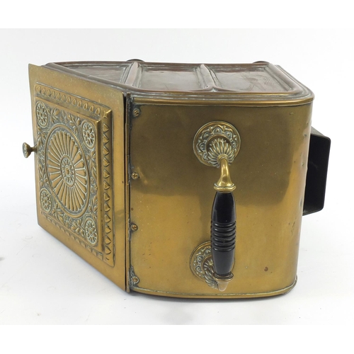 144 - Victorian aesthetic brass coal box with iron shovel, the sloping hinged front with circular floral m... 