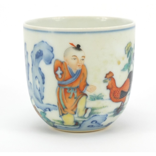 216 - Chinese doucai porcelain tea cup, hand painted with a young boy and chicken, calligraphy to the reve... 