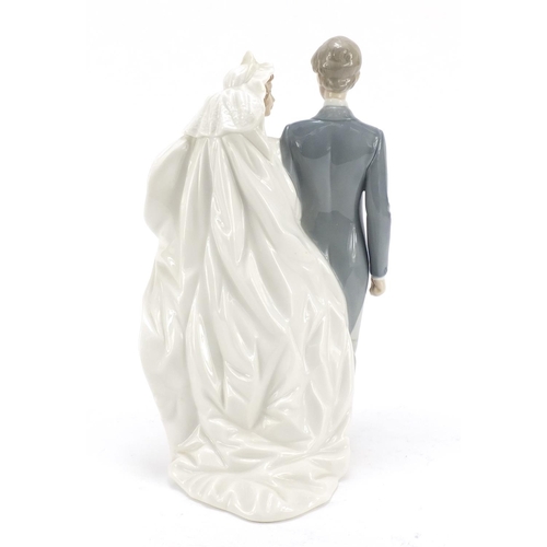 485 - Nao figure group of a bride and groom, 31cm high