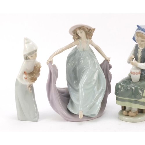 487 - Four Lladro and Nao figure groups, the largest 23cm high