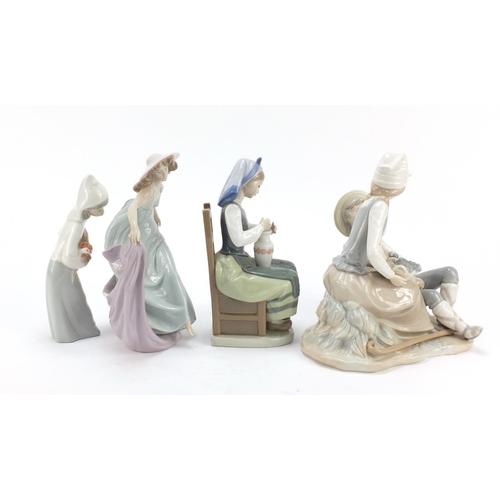 487 - Four Lladro and Nao figure groups, the largest 23cm high