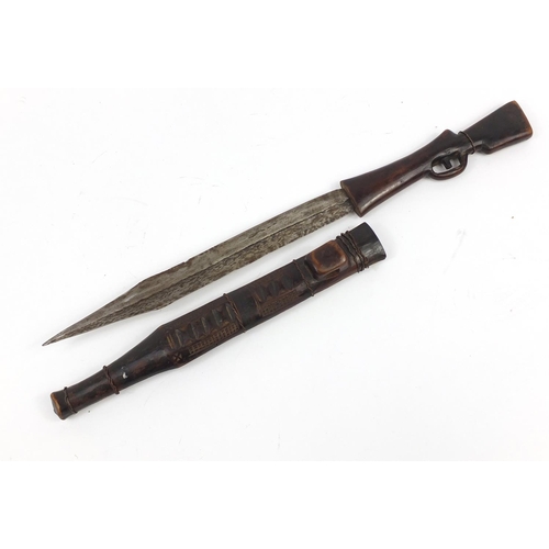 900 - African carved wood sword in the form of a rifle with steel blade, 71cm in length