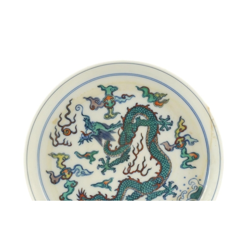 127 - Chinese doucai porcelain footed dish, hand painted with a dragon in clouds chasing flaming pearl, si... 