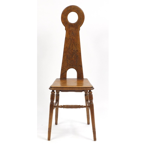 1396 - Arts & Crafts mahogany hall chair with stylised tree and floral carved back, 108cm high