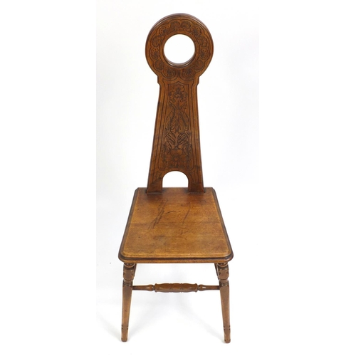 1396 - Arts & Crafts mahogany hall chair with stylised tree and floral carved back, 108cm high