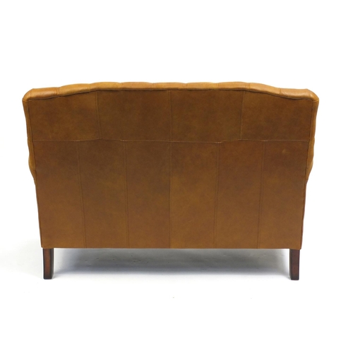 1316 - Two seater settee with tan button back upholstery, 94cm H x 130cm W x 85cm D