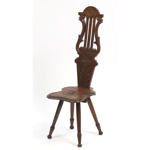 1335 - Decorative oak chair carved with peacock heads, 91cm high