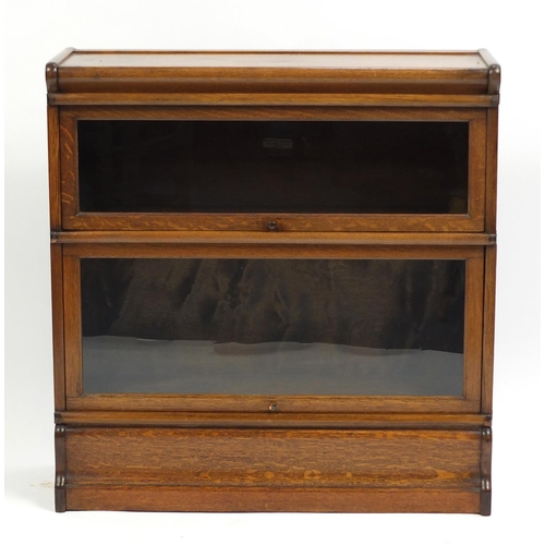 1319 - Oak Globe Wernicke two section bookcase with drawer to the base, 89cm H x 87cm W x 30.5cm D