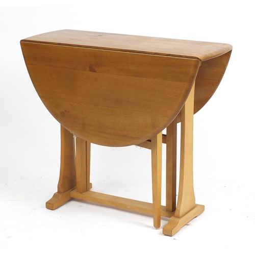1312 - Ercol Windsor elm gateleg table, 71cm H x 110cm W (extended) x 84cm D