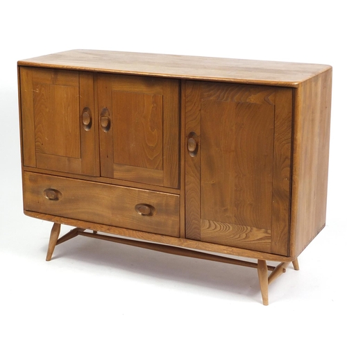 1303 - Ercol Windsor light elm sideboard with three doors and drawer, 81cm H x 114cm W x 49cm D
