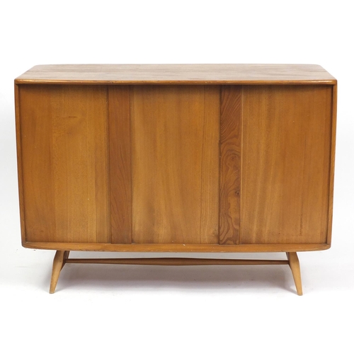 1303 - Ercol Windsor light elm sideboard with three doors and drawer, 81cm H x 114cm W x 49cm D