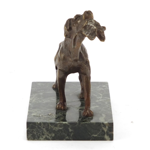 405 - Patinated bronze Pointer dog raised on a rectangular green marble base, 14cm wide