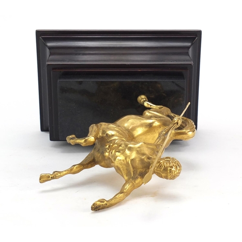 404 - Classical gilt metal sculpture of a centaur, raised on a rectangular black marble and mahogany base,... 