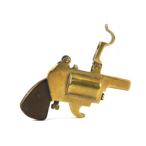 389 - Novelty brass lighter in the form of a pistol with bakelite grip, 8.5cm in length