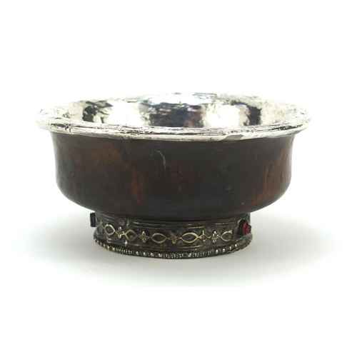 614 - Middle eastern hardwood bowl with unmarked silver mounts, 13cm diameter