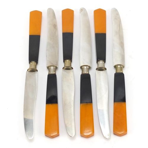 1166 - Art Deco orange and black Bakelite knife holder with six knives, 20cm wide