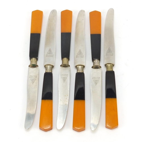 1166 - Art Deco orange and black Bakelite knife holder with six knives, 20cm wide