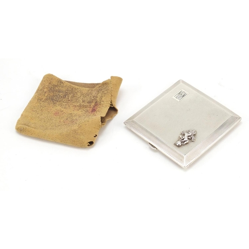 659 - Turner & Simpson, silver compact with applied military crest and engine decoration, Birmingham 1947,... 