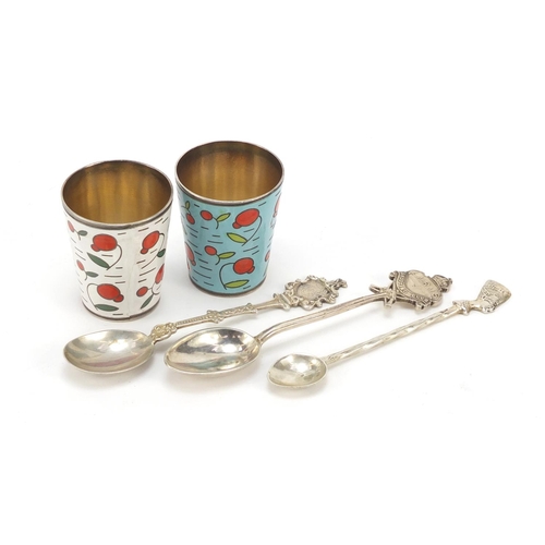 1985 - Two silver plate and enamel spirit measures and three white metal collector's spoons, the largest 5c... 