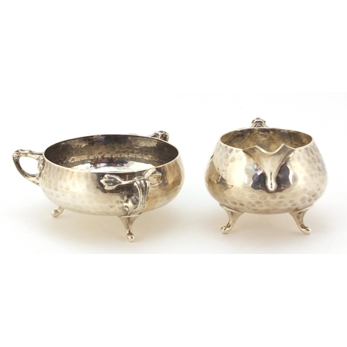18 - Northern Goldsmith Company, Arts & Crafts planished silver milk jug and sugar bowl, London 1901, the... 