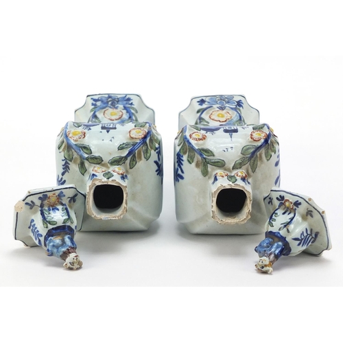 346 - **WITHDRAWN**Pair of Dutch Delft pottery vases and covers hand painted with village scenes, 21cm hig... 