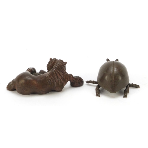 580 - Two Japanese patinated bronze animals, each with impressed marks to the bases, the largest 7cm in le... 