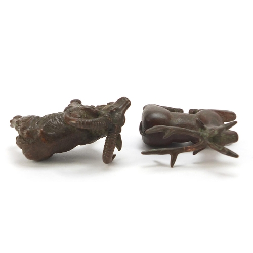 581 - Two Japanese patinated bronze models of animals, one with impressed marks to the base, the largest 9... 