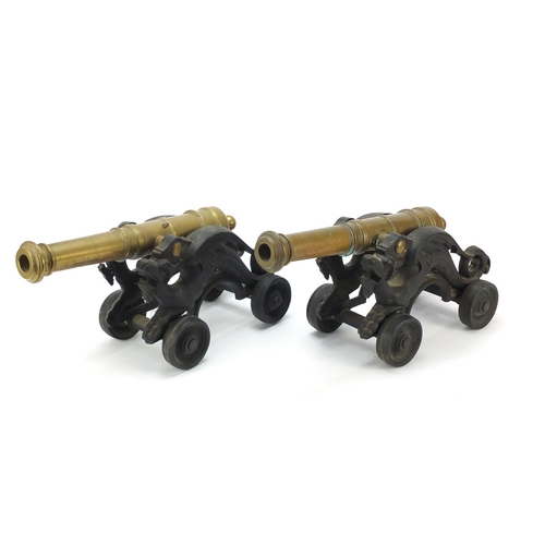 62 - Pair of early 20th century bronze and cast iron cannons, each 45cm in length