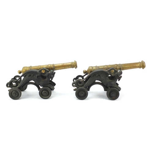 62 - Pair of early 20th century bronze and cast iron cannons, each 45cm in length