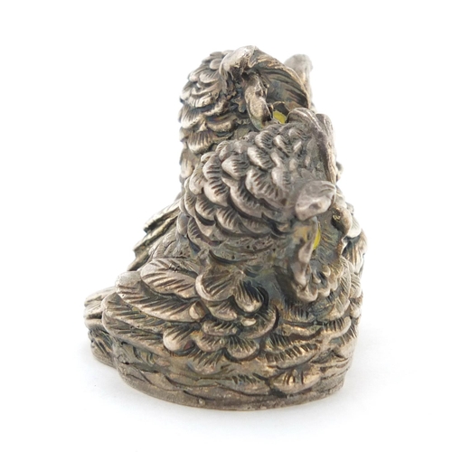 305 - Novelty silver filled model of two owls with glass eyes, 4.2cm high