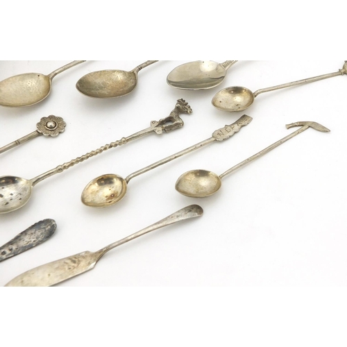 761 - Silver and white metal objects including two miniature photo frames, sugar tongs and teaspoons, vari... 