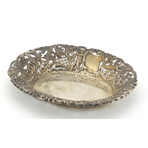 457 - Goldsmiths & Silversmiths Company, Edward VII pierced silver bonbon dish, embossed with Putti and bi... 