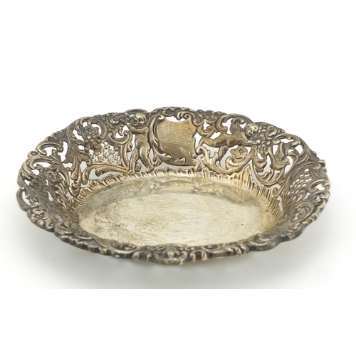 457 - Goldsmiths & Silversmiths Company, Edward VII pierced silver bonbon dish, embossed with Putti and bi... 
