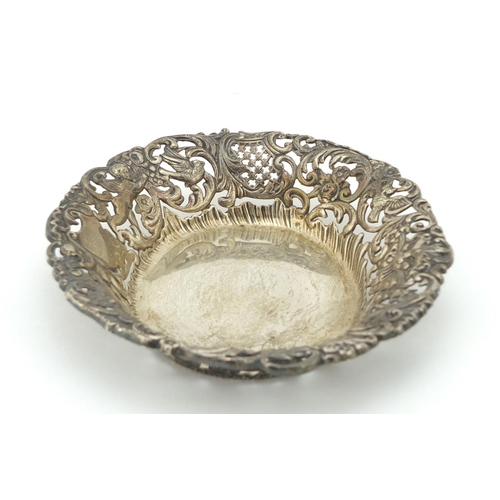 457 - Goldsmiths & Silversmiths Company, Edward VII pierced silver bonbon dish, embossed with Putti and bi... 