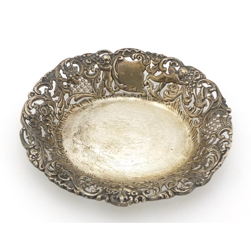 457 - Goldsmiths & Silversmiths Company, Edward VII pierced silver bonbon dish, embossed with Putti and bi... 