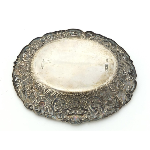 457 - Goldsmiths & Silversmiths Company, Edward VII pierced silver bonbon dish, embossed with Putti and bi... 