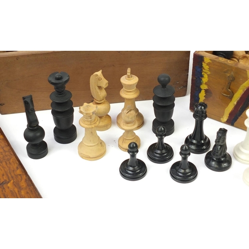 1980A - Three sets of wooden and composite chess pieces and a inlaid oak chess board, 43.5cm x 43.5cm