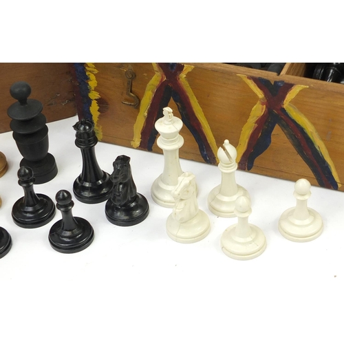 1980A - Three sets of wooden and composite chess pieces and a inlaid oak chess board, 43.5cm x 43.5cm